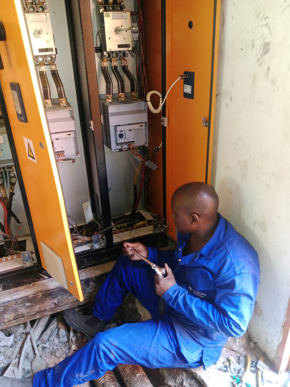 Technician working on an electrical installation cabinet
