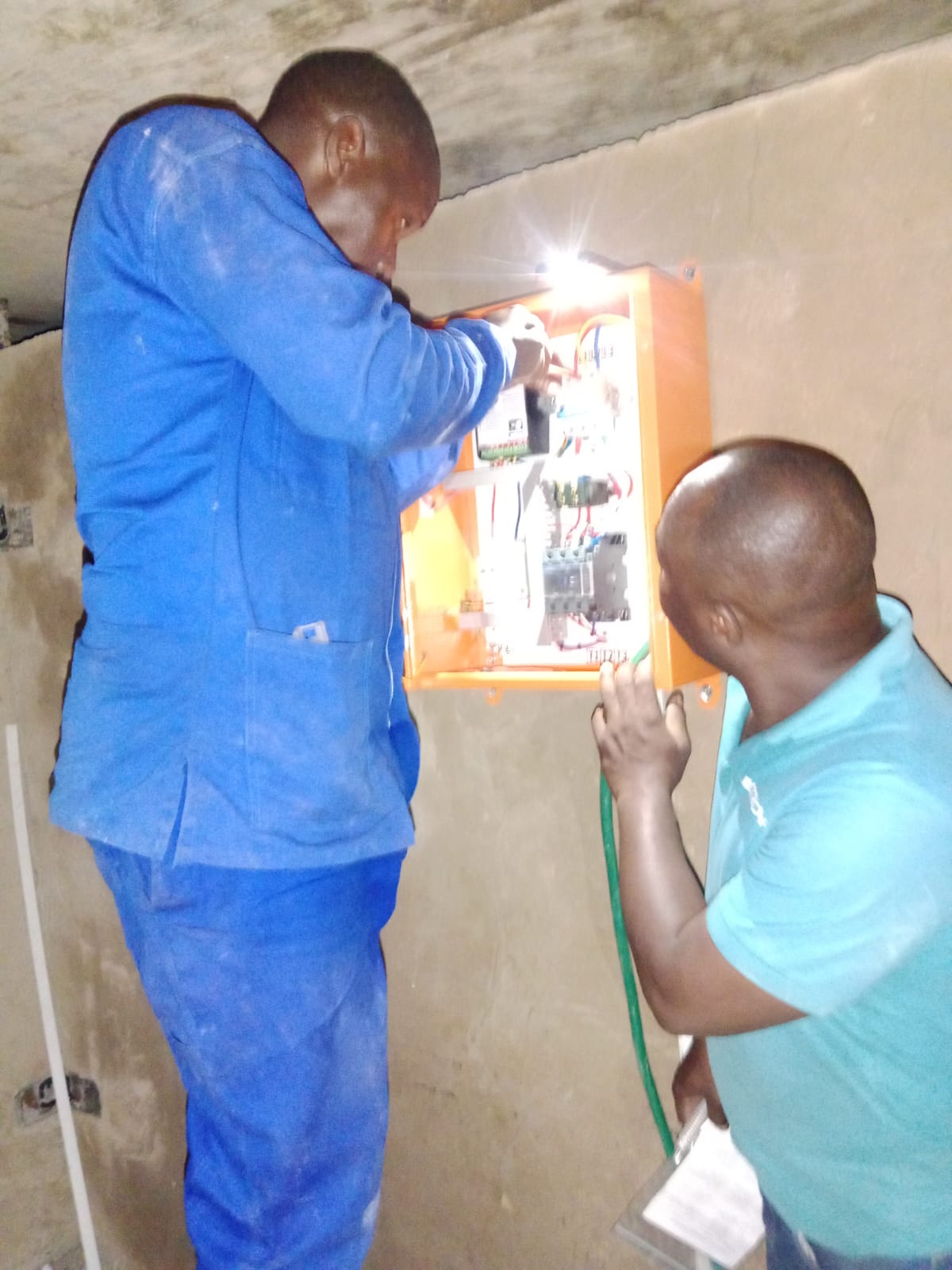 TATT team completing indoor electrical panel work