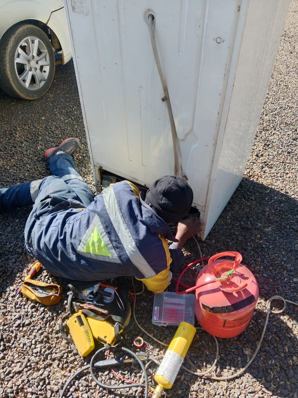Technician working on outdoor electrical or signal cabling